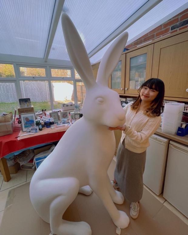 Hampshire Chronicle: Raine Yeung with the six-foot tall hare 